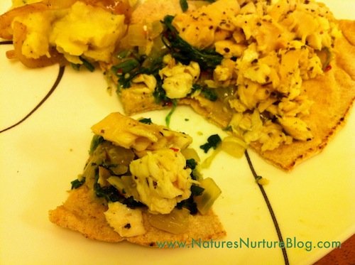 tilapia and dandelion greens on pita