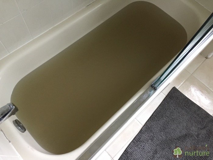 Leftover strip water from stripping a load of sheets and towels. This is what your homemade laundry soap is leaving behind in your fabrics!